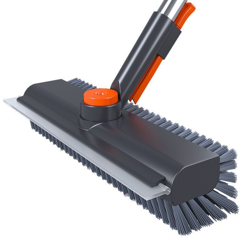 Gray and orange broom with a flat brush head on a white background